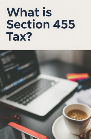 Laptop on desk with tax documents and a coffee cup, displaying the title “What is Section 455 Tax?” on screen